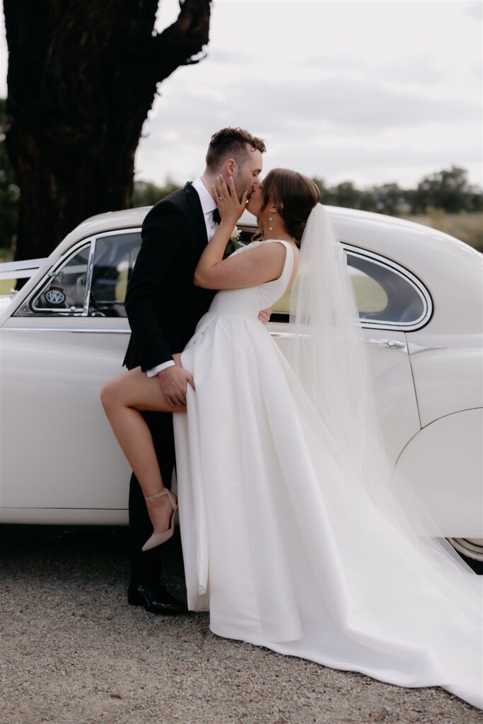 Wedding couple with vintage car at Harriet by Hubert Estate Wedding